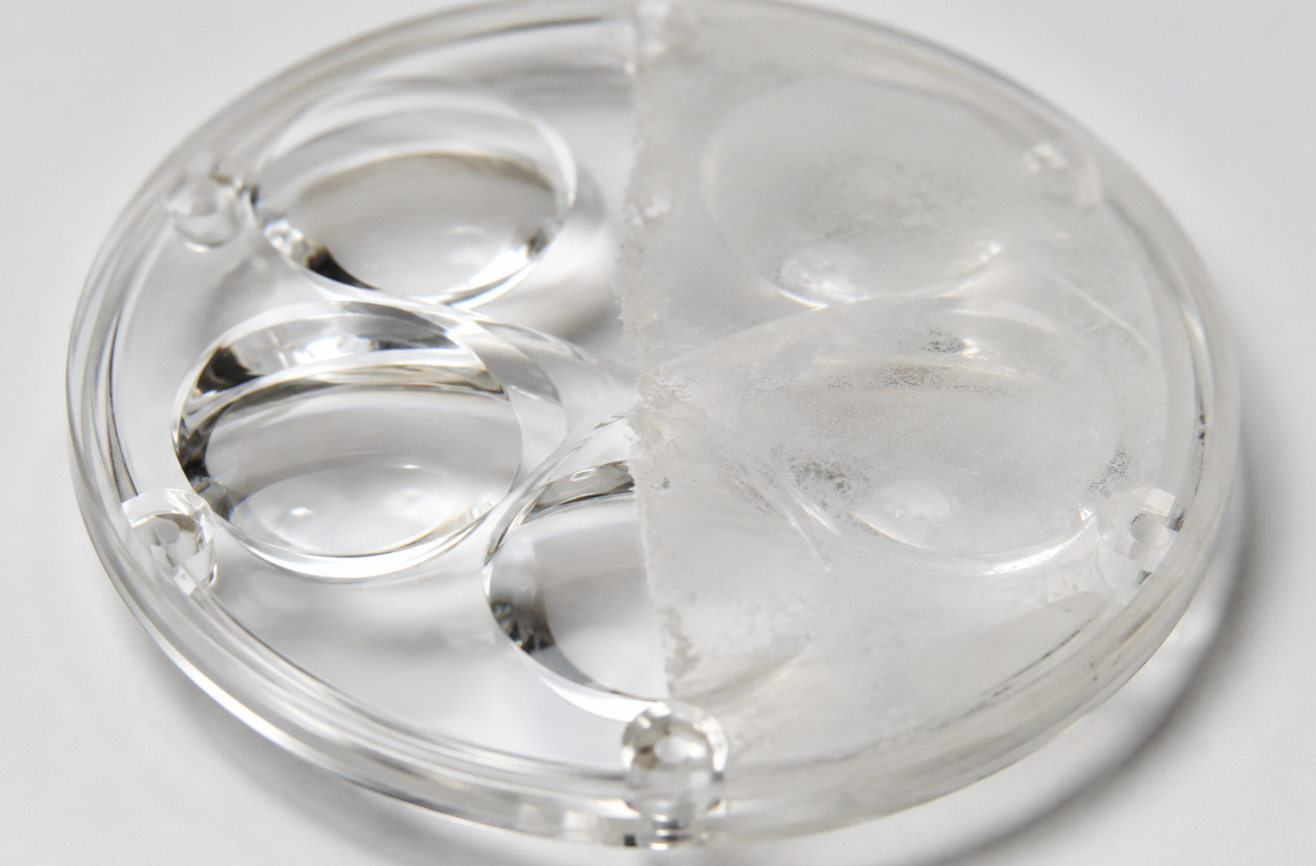 Sealed outdoor LED street light fixture with cross-section showing internal driver compartment and optical assembly